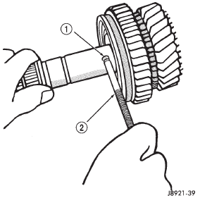 Fig. 103 Remove First Gear Bearing Inner Race Lock Ball