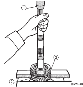 Fig. 104 Remove Second Gear, Reverse Gear, And 1-2 Synchronizer